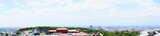 Fototapeta Londyn - Aerial view of Naha city and sea shore from Shurijo castle in Okinawa, japan. Panorama - 沖縄 那覇市の街並みと海 パノラマ