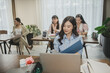 © nikomsolftwaer - Women asian working together, at office. young business woman reading sitting at the desk on office background