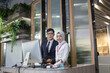 © nikomsolftwaer - young Asian reception team hotel front desk welcoming . Asian reception welcoming the customer into hotel front desk counter for service the customer,