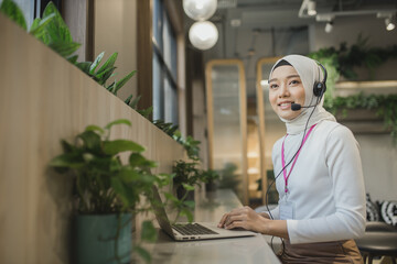 Wall Mural - businessman operator telemarketer working on laptop at workplace. Communication support, call center and customer service help desk. Service Team Concept. Operator or Contact Center Sale in Office