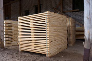 Detail of wooden planks. Wooden pallets. Wood. Lumber. A stack of new wooden planks in the lumber industry.