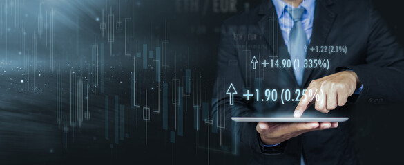 Wall Mural - businessman forex trader using tablet technology indicating rising trend growth in the market, analy