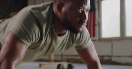 Wall Mural - Black soldier doing push ups in gym