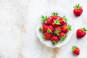 Strawberry fresh juicy fruits berries ripe harvest sweet dessert summer organic on the table healthy meal copy space food background rustic top view keto or paleo diet veggie vegan or vegetarian food