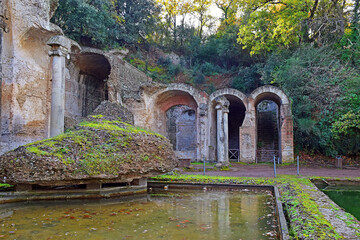 Wall Mural - ancient pool called Canopus, surrounded by greek sculptures in Villa Adrian (Hadrian's Villa) and reflections in water in Tivoli, Italy