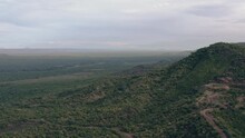 Aerial View Of The Omo Valley In Ethiopia! Nier Landscape With Ridges And Rocks With Forests And Trees And Below The Savannah With Bushes And Wildlife! Drone Video Of The African Landscape.