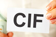 © Maks_Lab - On the table are bills, a bundle of dollars and a sign on which it is written - cfi, concept