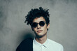 © SHOTPRIME STUDIO - emotional guy with curly hair teen classic suit sunglasses shirt model