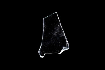 Wall Mural - broken glass. piece of window isolated on a black background