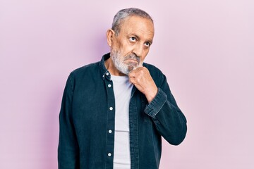 Poster - Handsome senior man with beard wearing casual denim shirt thinking concentrated about doubt with finger on chin and looking up wondering