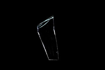 Wall Mural - glass fragments in isolation on a black background. damaged window. damaged object