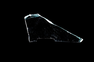 Wall Mural - glass fragments in isolation on a black background. damaged window. damaged object