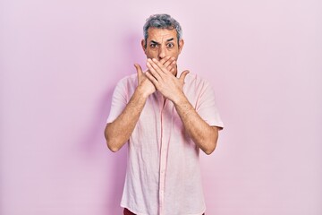 Poster - Handsome middle age man with grey hair wearing casual shirt shocked covering mouth with hands for mistake. secret concept.