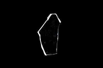 Wall Mural - glass fragments in isolation on a black background. damaged window. damaged object
