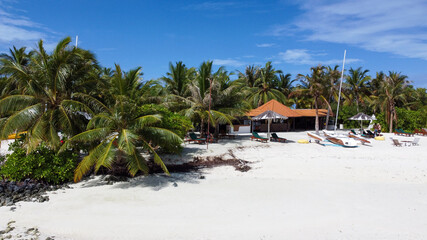 Wall Mural - Maldives resort island drone aerial view, Indian ocean atoll nature beach and palm forest, leisure tourist luxury vacation