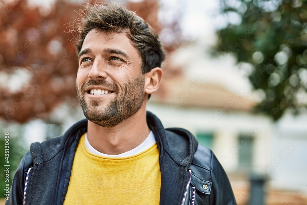 Handsome hispanic man with beard smiling happy outdoors - obrazy, fototapety, plakaty 