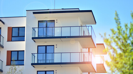 Condominium and apartment building with  symmetrical modern architecture in the city downtown.