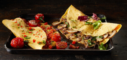 Wall Mural - Tasty vegetarian omelettes on tray on table