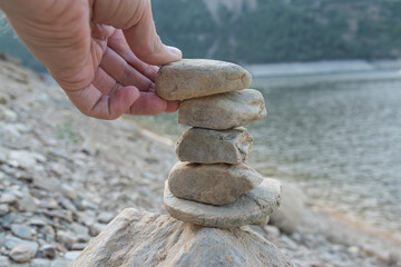 The balance of the pebbles of the sea. The concept of balance, harmony, meditation. Concept of togetherness, Helping to rise.