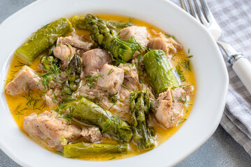 Wall Mural - Turkey stew in gravy with asparagus and dill. Meat goulash