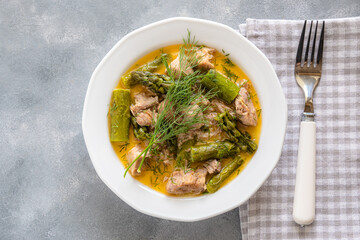 Wall Mural - Turkey stew in gravy with asparagus and dill. Meat goulash