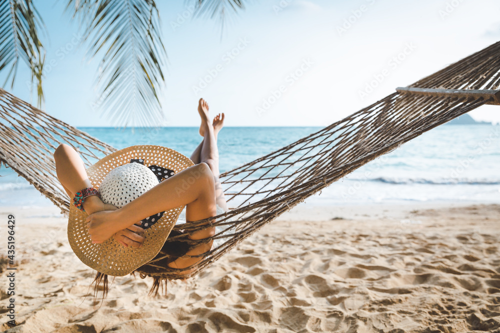 Traveler asian woman relax in hammock on summer beach Thailand - obrazy, fototapety, plakaty 