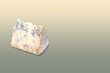 stilton cheese over matching colour background