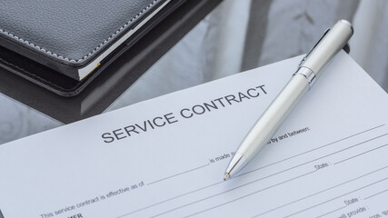 Wall Mural - A service contract form on the desk. Agreement.
