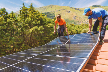workers assemble energy system with solar panel for electricity and hot water