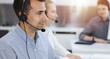 © Iryna - Call center. Group of casual dressed operators at work. Adult businessman in headset at customer service office. Telesales in business