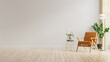 © Vanit่jan - Living room interior wall mockup in warm tones with leather armchair on white wall background.