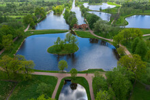 A Panoramic View From A Height Of The Ponds And The Landscape Park In Peterhof, The Meadow Garden, Walking Paths, The Destroyed Pavilion.