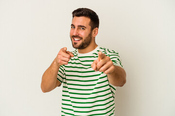 young caucasian man isolated on white background cheerful smiles pointing to front.