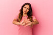 Young mexican woman isolated on pink background doing a denial gesture