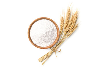 Flat lay of Wheat flour in wooden bowl with wheat spikelets isolated on white background.