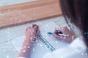businesswoman is writing down some ideas to create innovative software to change the world and provi