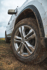 Wall Mural - suv car with dirty wheels in mud