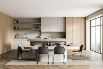 Light and wooden kitchen interior with table and chairs near window