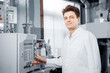 © Parilov - Male operator engineer controls production line from control panel, food factory