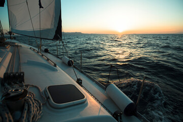 Fototapete - Yacht boat in the open Sea during amazing sunset. Luxury Sailing.