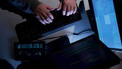 Overhead shot of computer hacker typing code