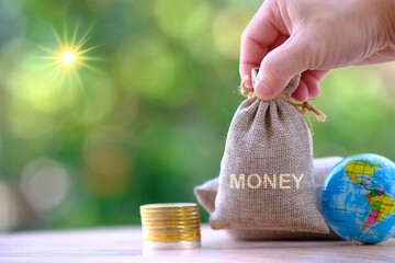 Poster - Money coin on table background and concept saving money, Business growth strategy of money concept, Advertising coins of finance and banking