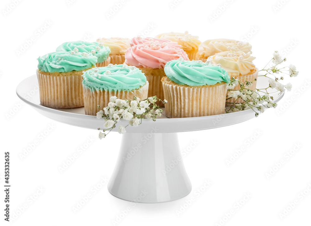 Dessert stand with tasty cupcakes and flowers on white background