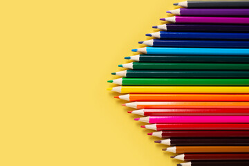 Wall Mural - Group of colorful pencils gradation on yellow background