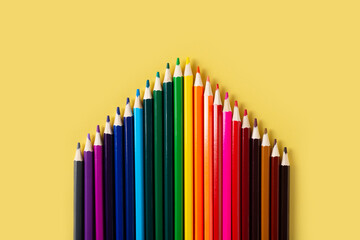 Wall Mural - Group of colorful pencils gradation on yellow background