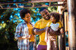 © liderina - African American family having fun outdoors.
