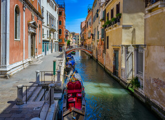 Wall Mural - Narrow canal with gondola in Venice, Italy. Architecture and landmark of Venice. Cozy cityscape of Venice.