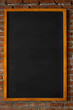 
image of blackboard frame on brick wall texture.vertical image