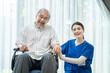 © Kawee - Portrait of senior patient and nurse sitting together in nursing home.