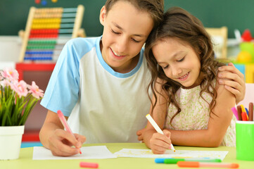 Wall Mural - Brother and sister drawing together